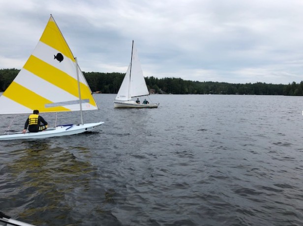 Two sailboats sailing on Lovell Lake