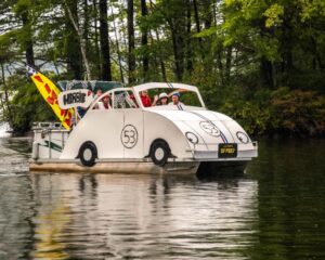 1st Place Entry in 2022 Lovell Lake Boat Parade from the Golden family with Herbie the Love Bug".