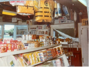 An old photo of the store interior, shelves, and products sold at Cochran's Marina.