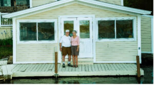 Jim and Libby Cochran posing for a photo in front of the old Marina Store entrance.